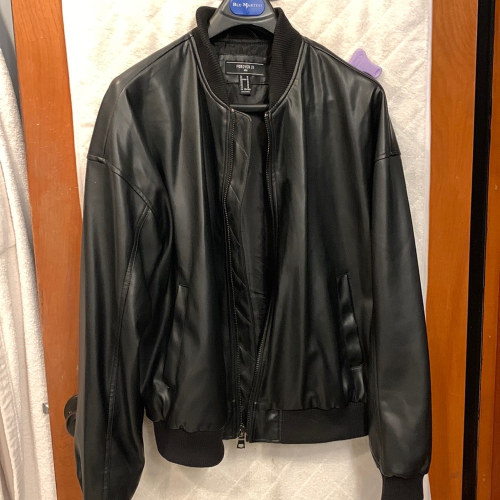 NWOT forever 21 faux leather jacket with “Blessed” insignia on back